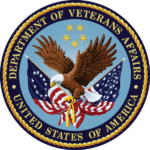 Seal_of_the_U.S._Department_of_Veterans_Affairs The official seal of the Department of Veterans Affairs: a shield featuring a stylized American eagle with wings spread, clutching a laurel wreath in its talons, set against a field of stars and stripes. Below the eagle, a ribbon bears the inscription 'Department of Veterans Affairs' in bold lettering.