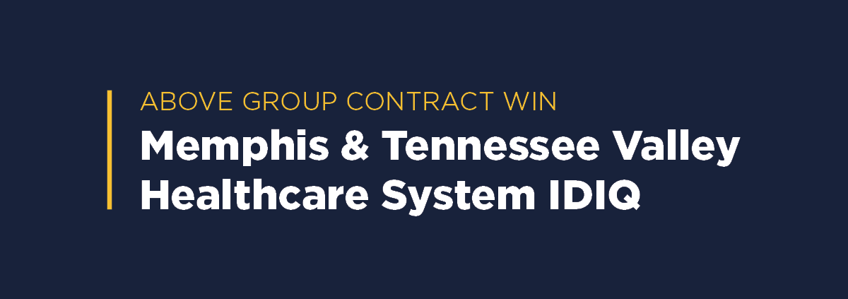 Graphic with yellow heading 'Above Group Contract Win' and text 'Memphis & Tennessee Valley Healthcare System IDIQ' on a navy blue background